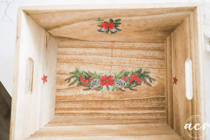 inside of wood tray with pointsettia transfer on bottom, bells transfer on back and red stars on sides