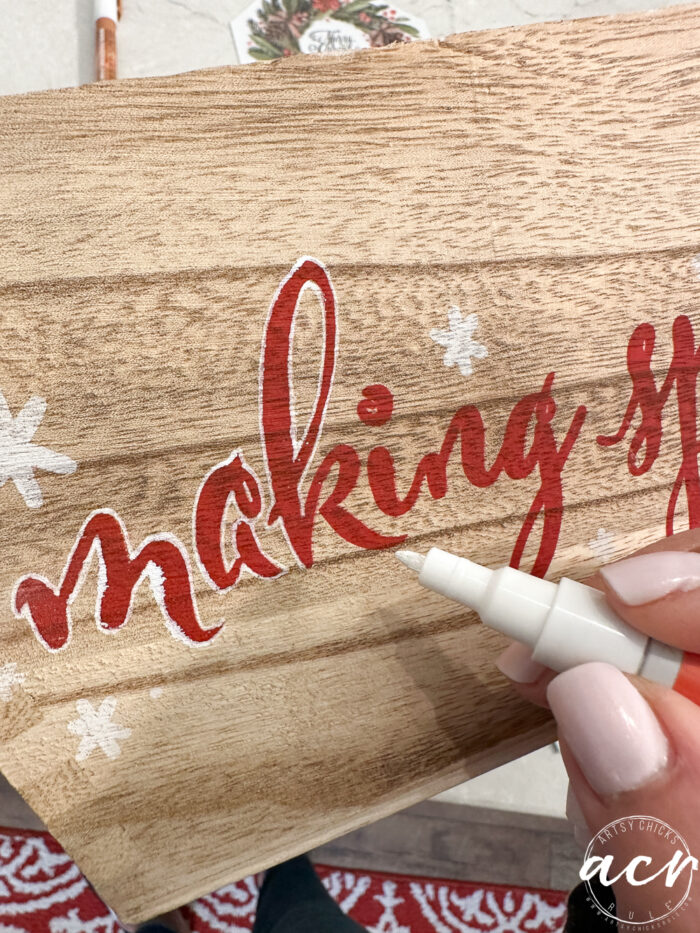 outlining the red writing with white pen