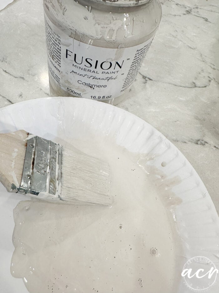paint brush in plate with watery paint