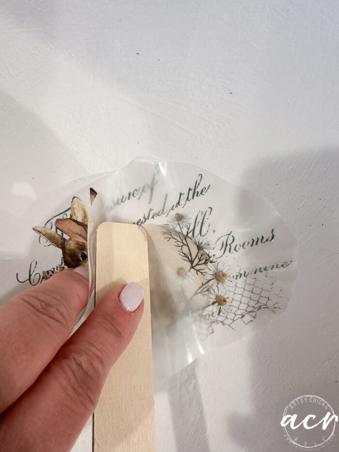 rubbing the transfer into the bottom of the bowl