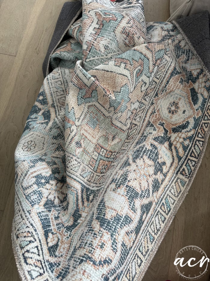 rug with blues black and corals teals
