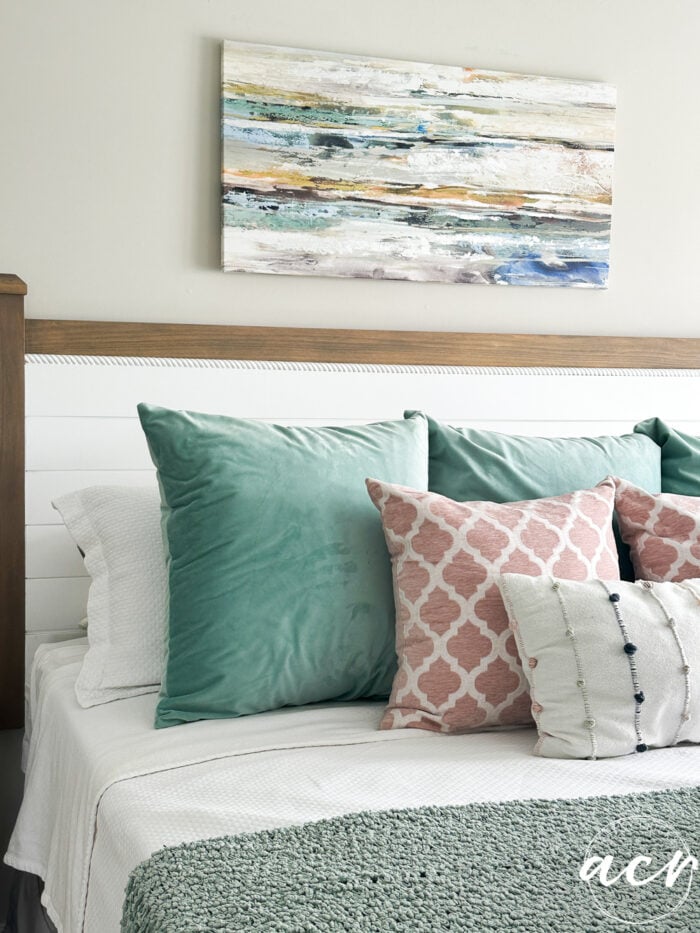 bed with aqua pillows