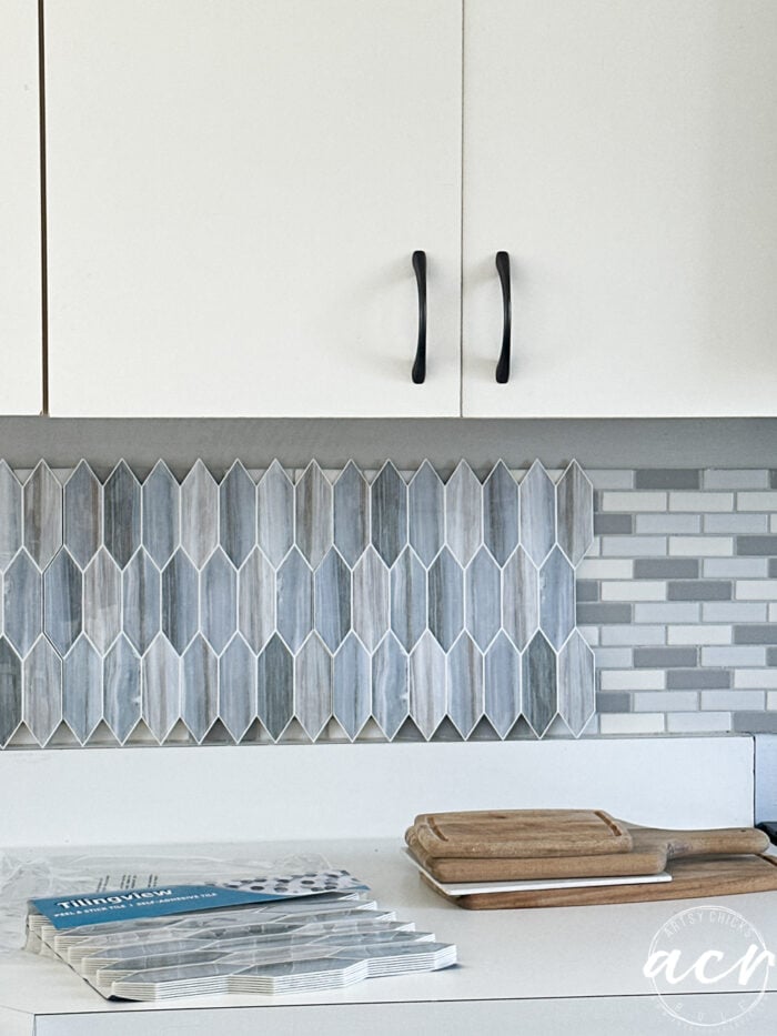 vinyl tile sitting up on backsplash