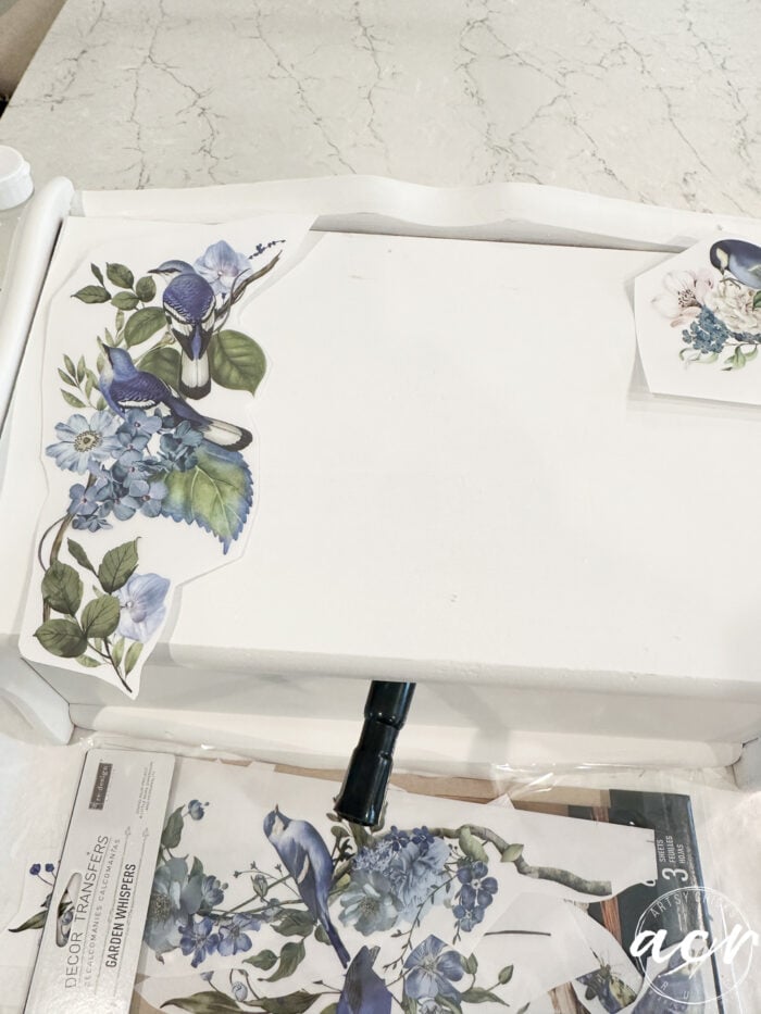 blue birds and greenery transfers on top of bread box