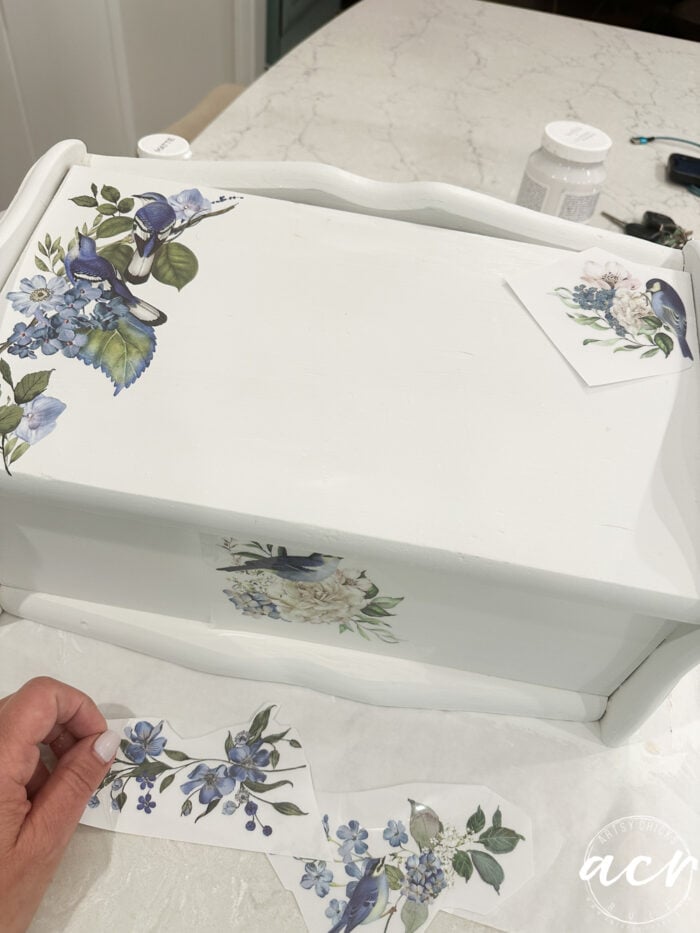 several blue bird transfer laying around bread box
