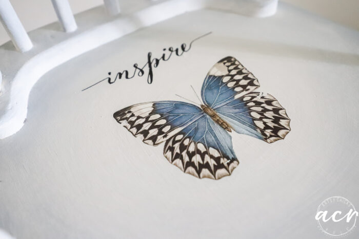 big blue butterfly on seat with the word inpsire
