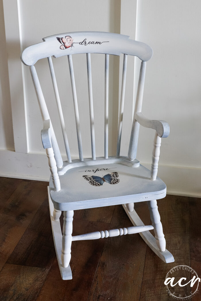 blue and white rocker against white wall