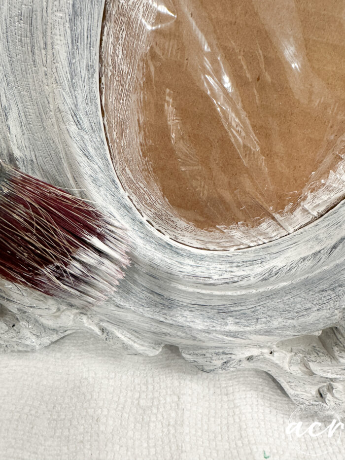 painting the birch onto the wood frame