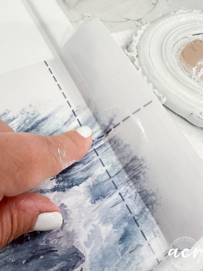 folded transfer laying on metal wine holder