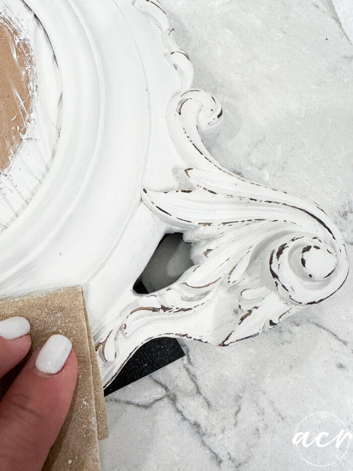 sanding the wood frame 