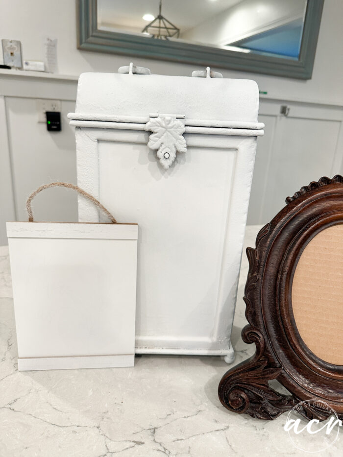 two of the smalls painted white on the counter