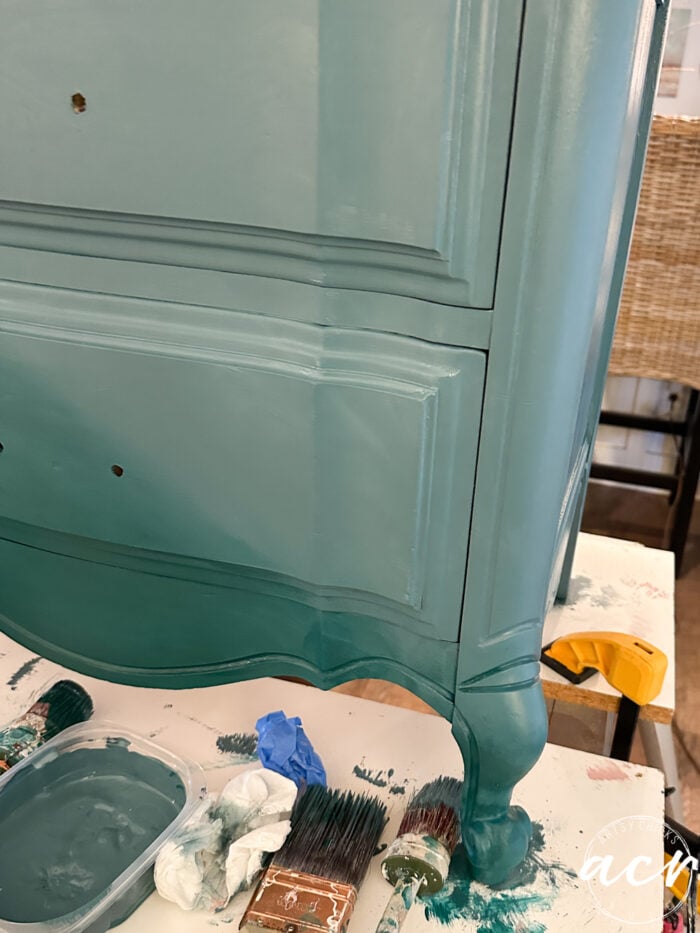 two blues painted onto the front of the nightstand
