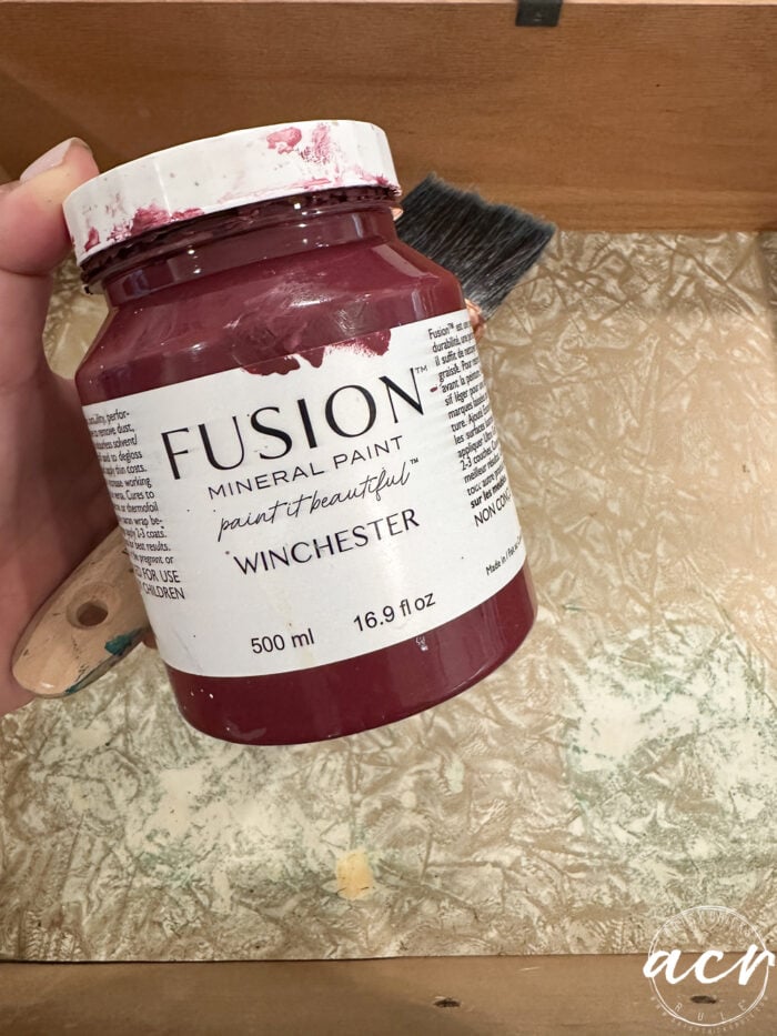 jar of reddish paint