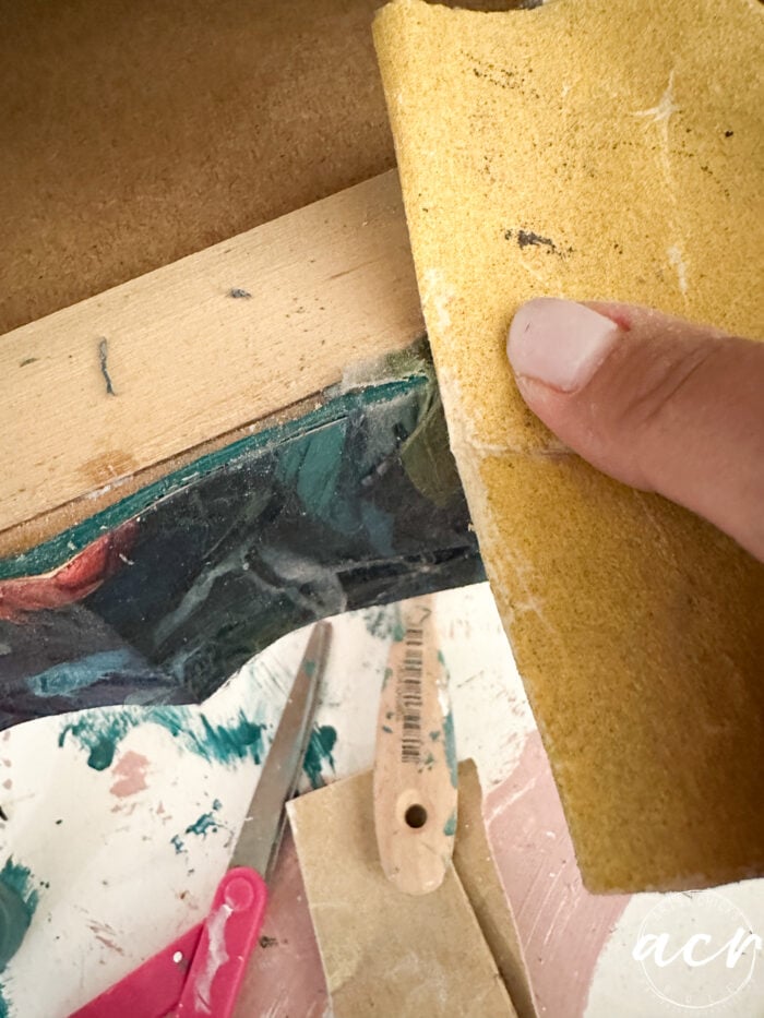 sanding off the excess once dry