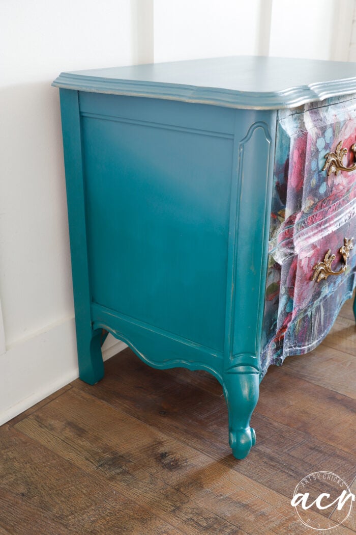 side of nightstand with two different colors of blue
