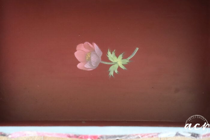 small flower stem on bottom drawer