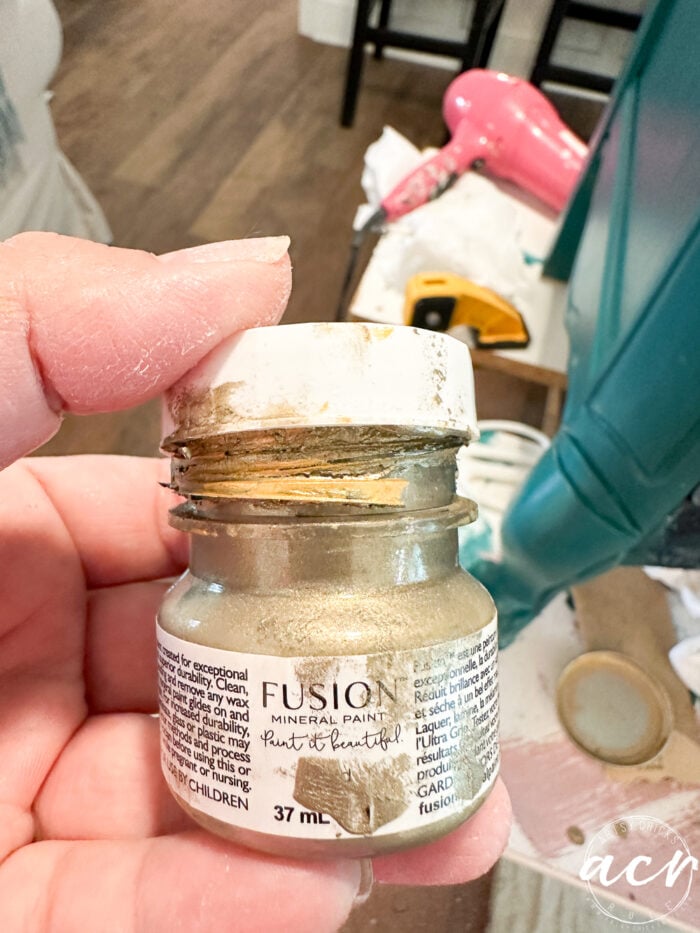 small jar of gold paint