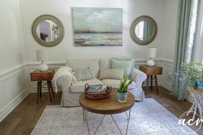 living area with newly restained tables couch and decorated walls etc