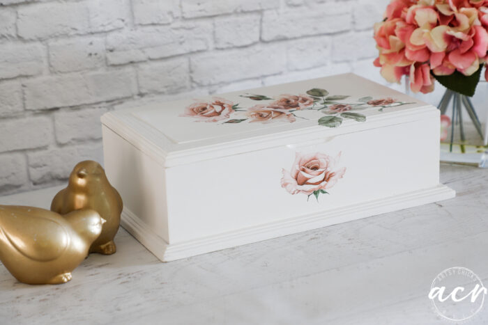 white box with pink flowers