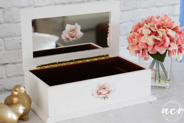 white jewelry box with pink roses open