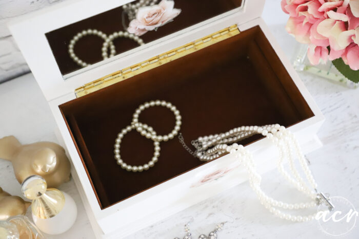 inside jewelry box with pearls and jewelry