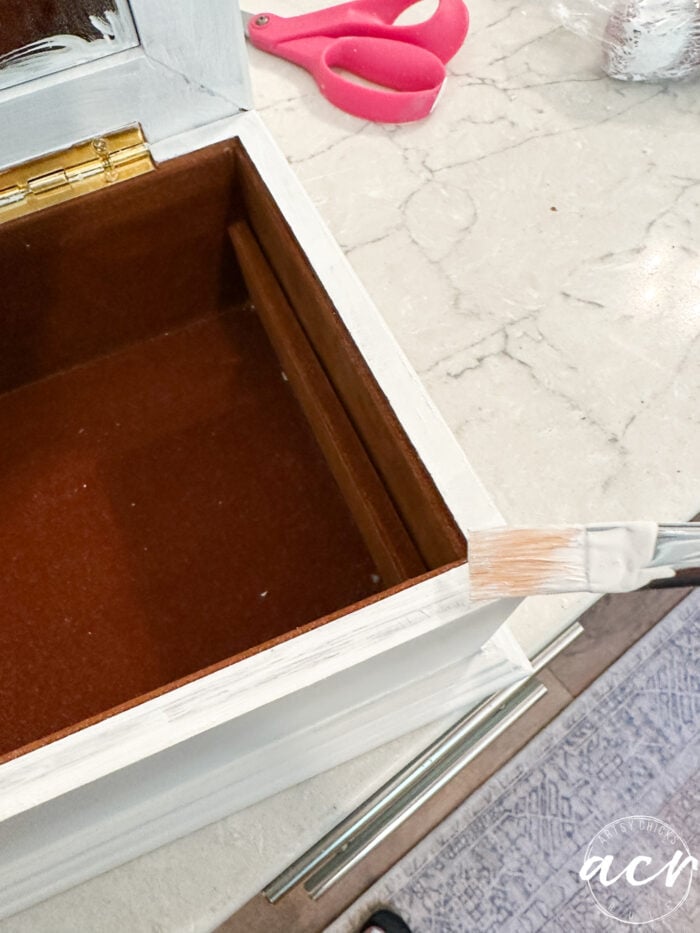 painting inside edge with small paintbrush