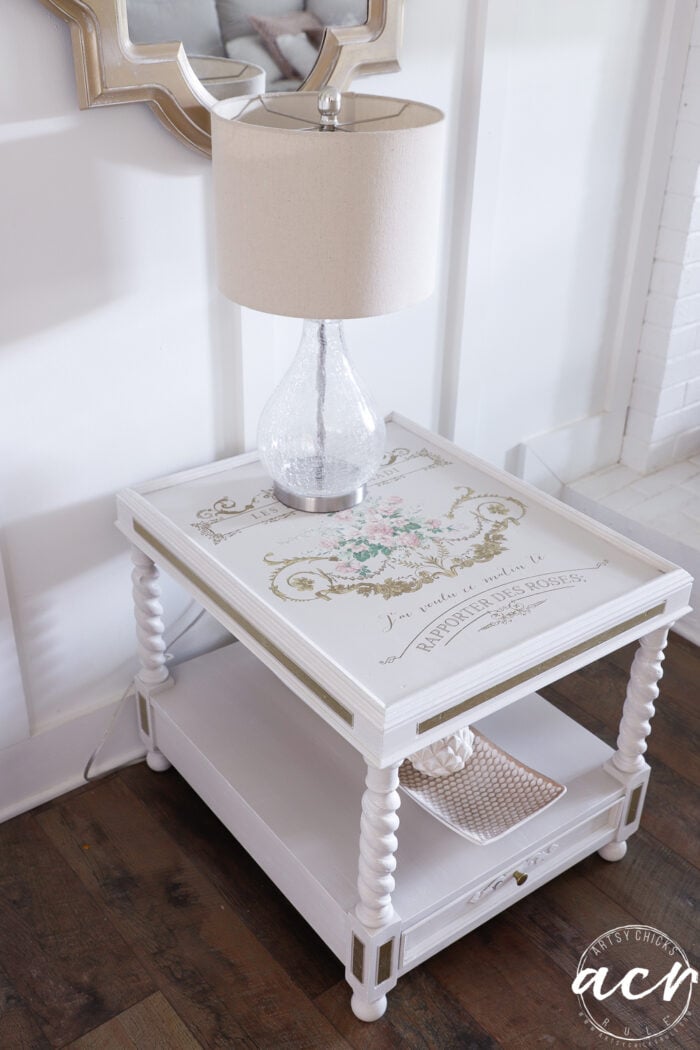 clear glass lamp on top of table side view