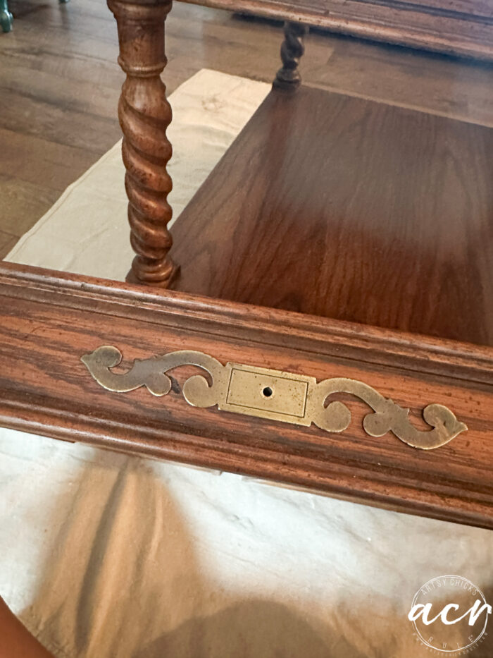 drawer front with gold swirl design 