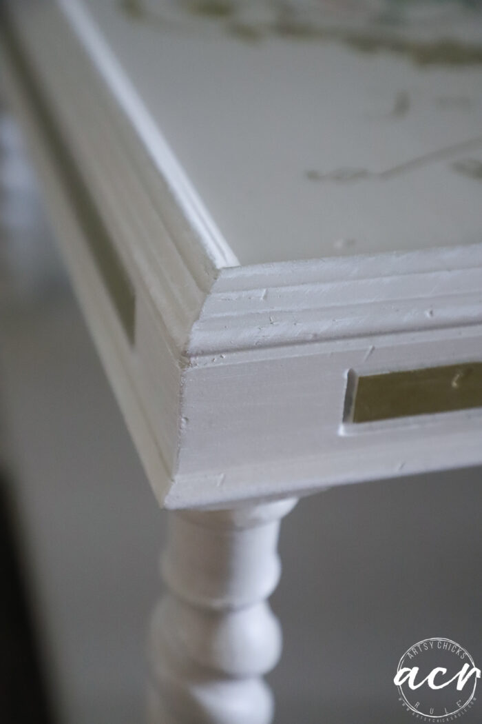 up close of corner painted off white with gold areas