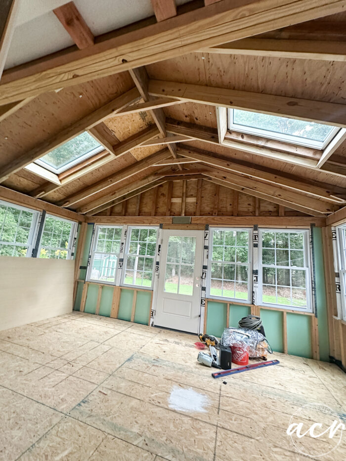 roughed in porch with vaulted ceiling, two skylights and windows going all the way around.