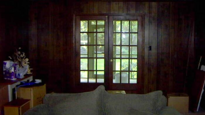 dark paneled walls with french doors