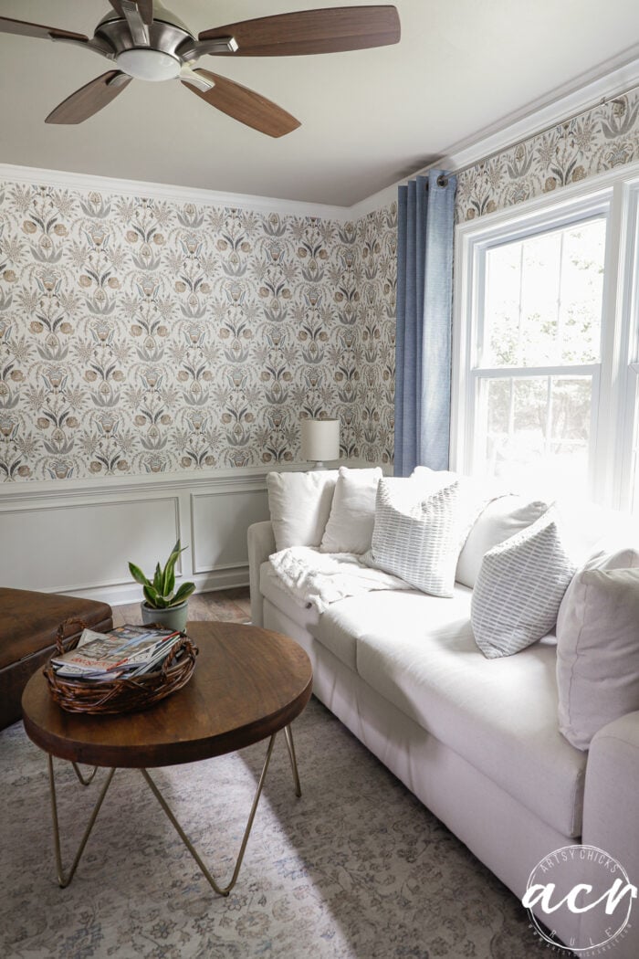 wallpaper with white couch and blue curtains