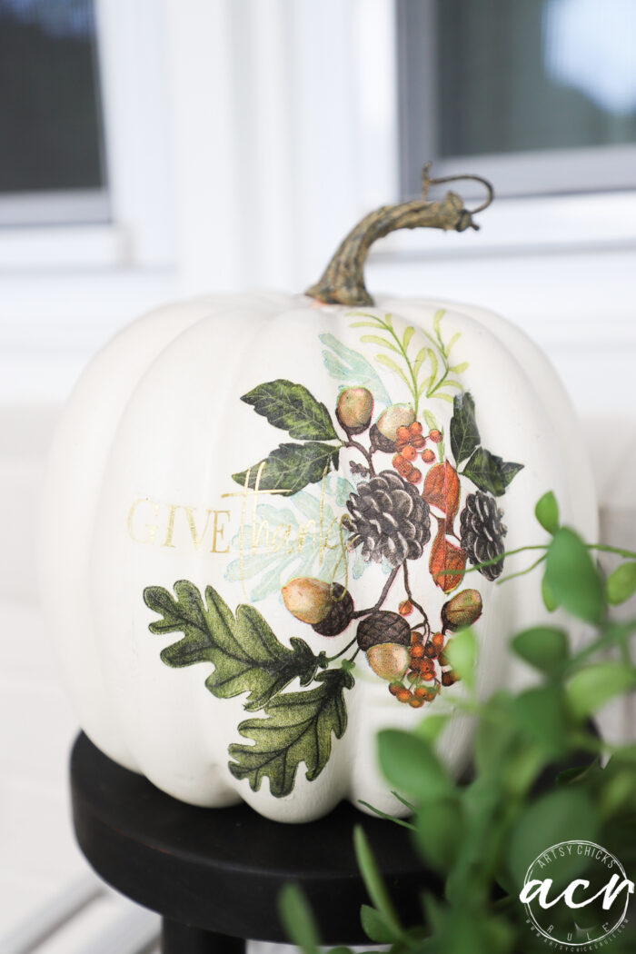 white decorative pumpkin with give thanks on it