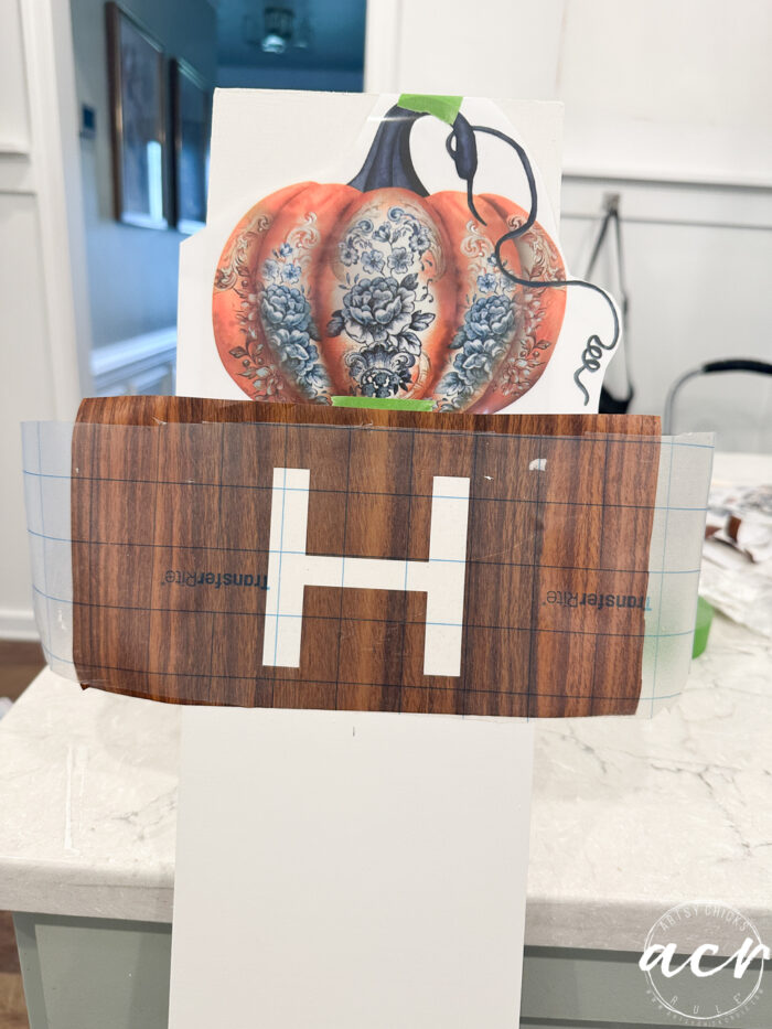 letter h on the board in a vinyl cutout