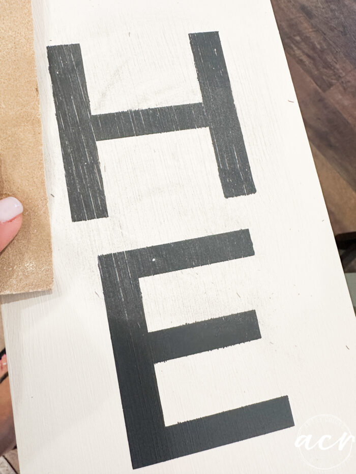 sanding the black letters