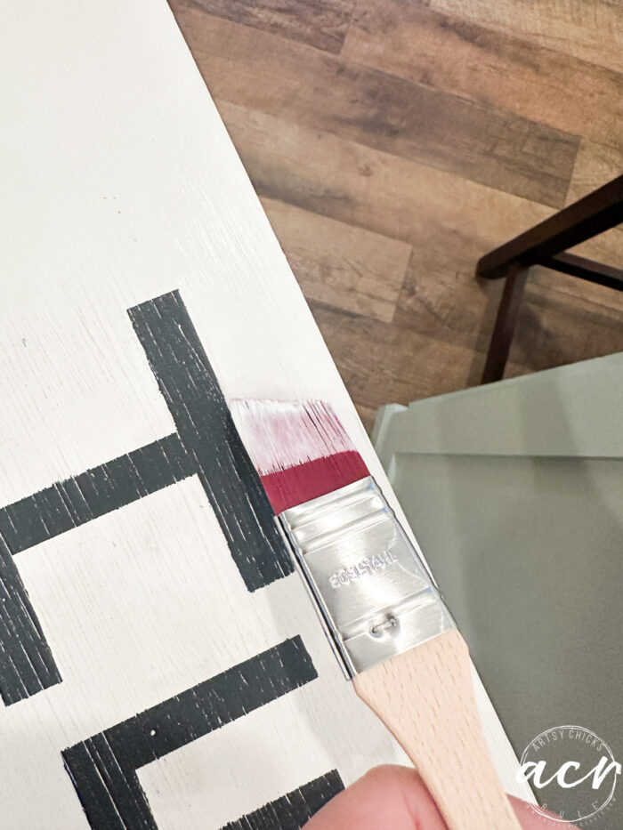 tiny angle brush painting white around black letters