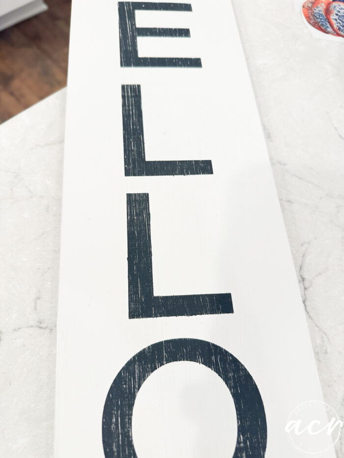 lightly distressed black lettering