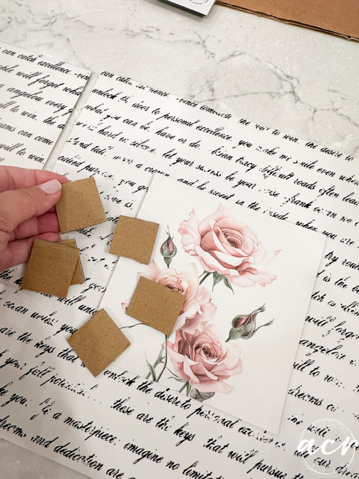 the two finished pieces with small card square cutouts