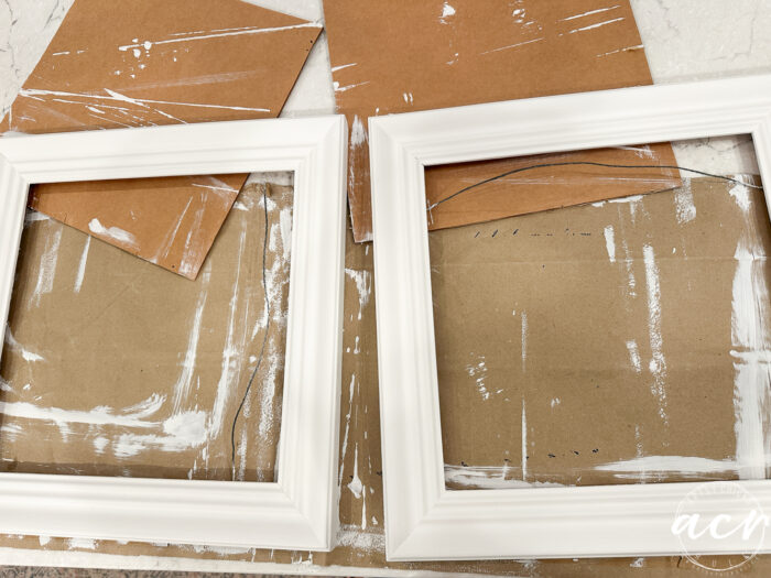 two white painted frames