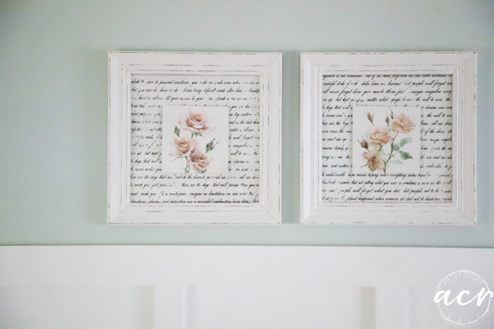 two framed artwork with script and roses hanging on wall