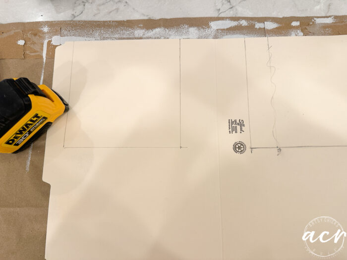 measuring where to cut the folder