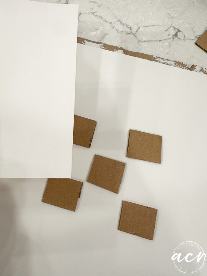 small cut cardboard pieces