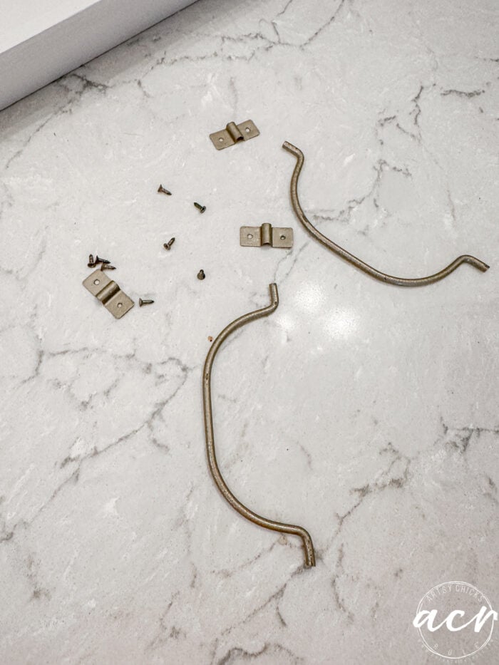 gold hardware laying on counter