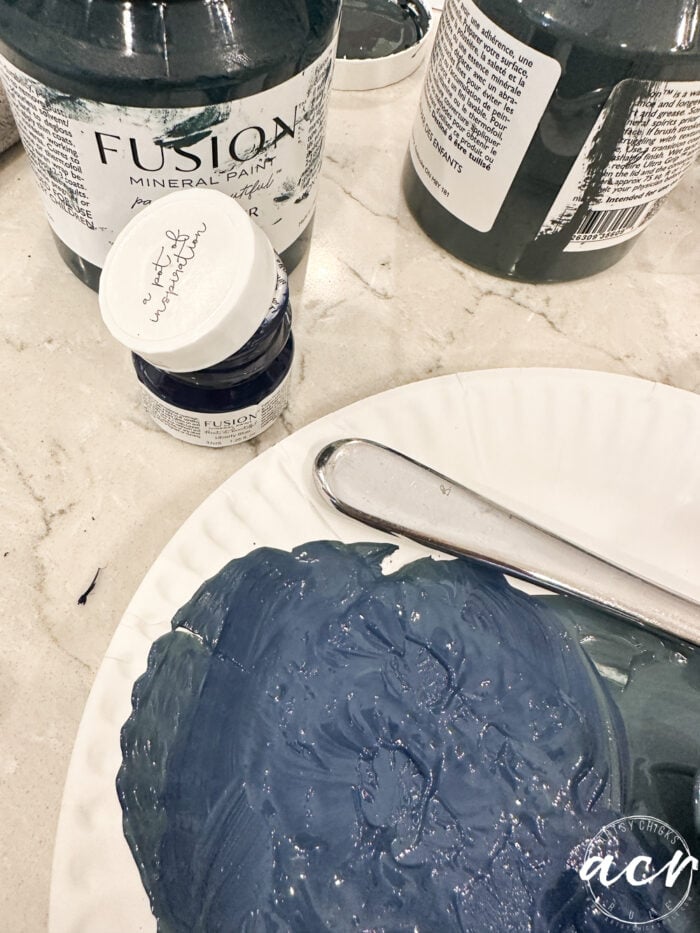 blue paint mixed up on paper plate