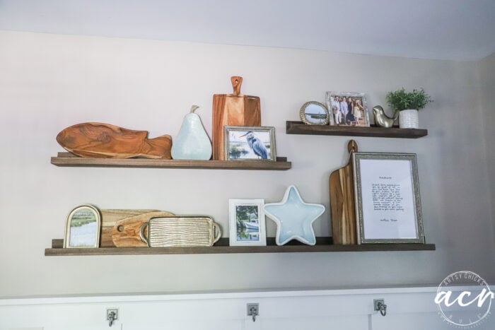 shelves hanging with decor on kitchen wall