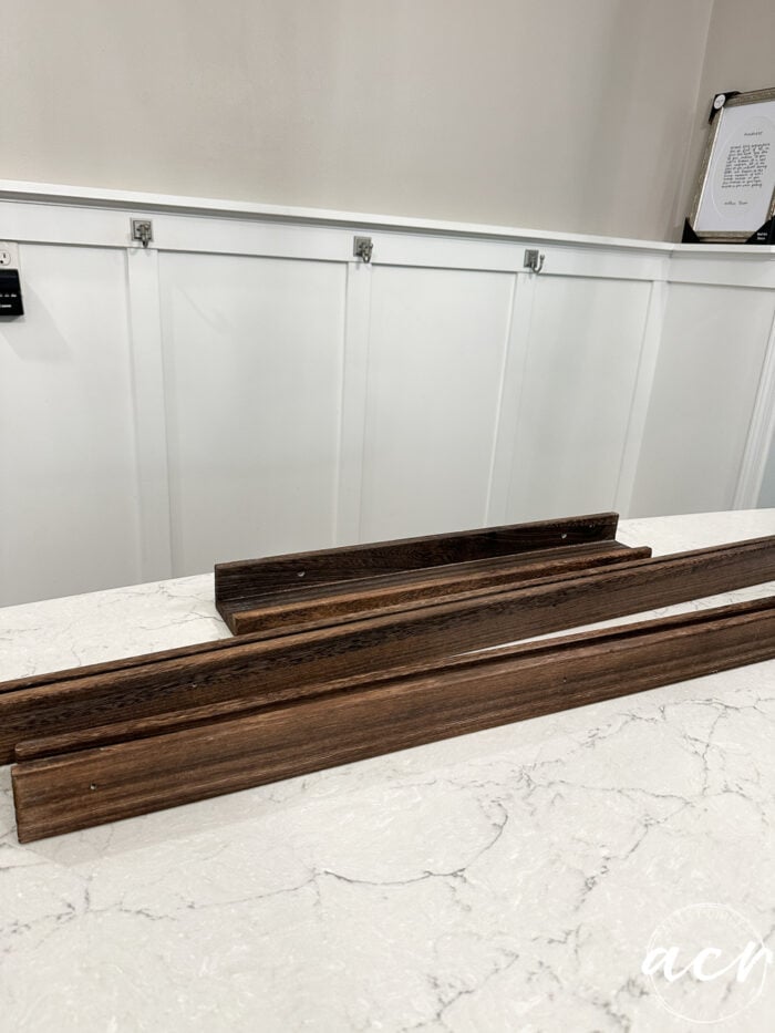 wood shelves sitting on island