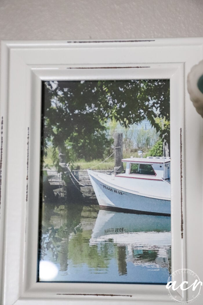 photo of a boat with reflection in the water