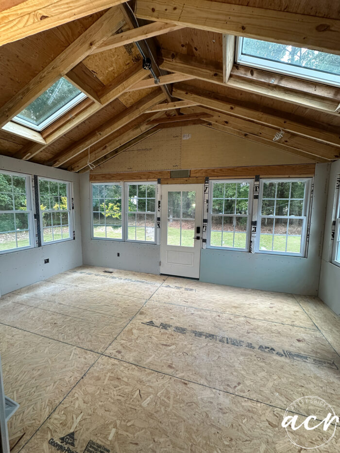 room with unfinished ceiling