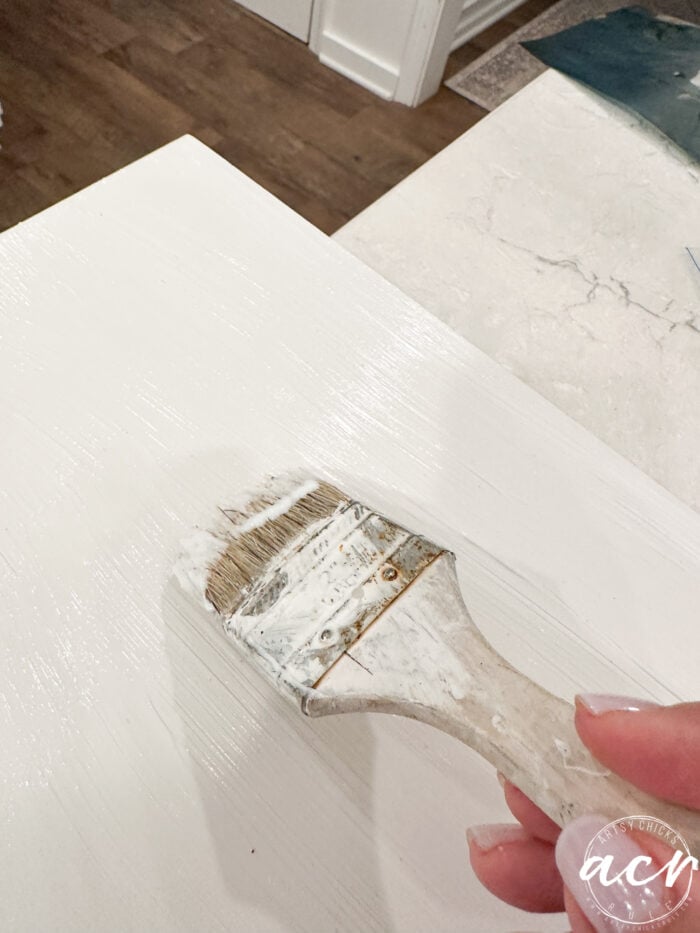 applying decoupage gel to top of box