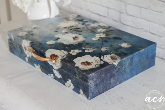 blue and white box with gold handle